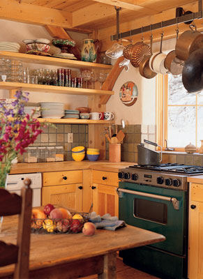 
Although many chemically sensitive people cannot tolerate a gas stove, it doesn’t bother Daryl. In fact, she prefers it for cooking. Pine cabinetry and butcher-block countertop are solid wood, hand-rubbed with ecological finishes. Because kitchen cabinetry can be expensive, Daryl put doors only on bottom cabinets and left top shelves open, which is the way she likes it, anyway. The backsplash is slate.
